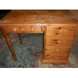 A single pedestal pine desk.