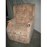 A good mid to late 20th century armchair together with a matching recline/raise armchair,