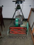 An old Qualcast Suffolk Punch 435 petrol mower.