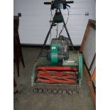 An old Qualcast Suffolk Punch 435 petrol mower.