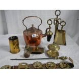 A Victorian copper kettles, a companion set, a gun shell, a horse brass and an old brass blotter.