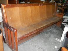 A long old church pew, Approximately 210 cm wide.