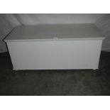 A large painted blanket box on wheels. 108 x 50 x 48 cm.