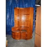 A pair of teak corner cupboard/shelf units, the small having lighting, 1 x H 200 cm, W 100 cm,