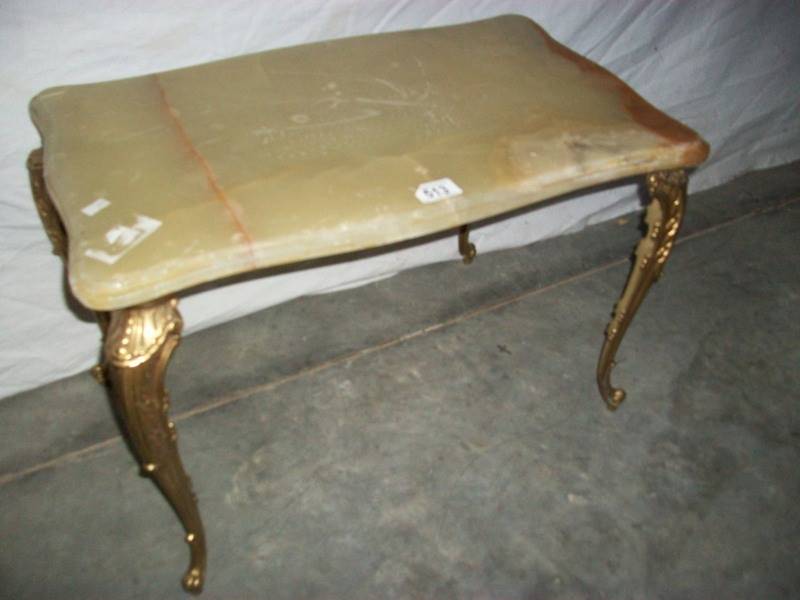 A French style marble topped table on gilded legs, 80 x 38 x 40 cm (marking on top is a seam).