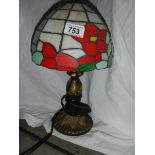 A table lamp with Tiffany style shade.