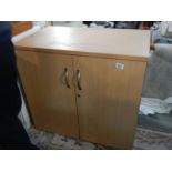 A 2 door teak office cabinet.