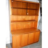 A good teak wall unit with sliding doors, 120 cm wide.