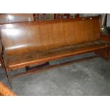 A long old church pew, approximately 210 cm wide.