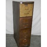 A glorious 1930's filing cabinet having 4 solid drawers with spring loaded separater's,