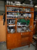 A teak wall unit with glazed top.