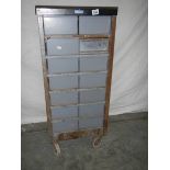 A 14 drawer metal chest on wheels, 105 x 48 x 46 cm.
