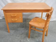 An unusual office desk with 2 drawers, lift up writing slope and chair, 115 x 60 x 72 cm.