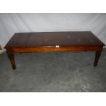 An oak "Long John" coffee table in fine condition, L 75, W 65, H 42 cm.