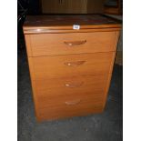 A Four drawer chest of drawers in the style of G Plan. In good condition.