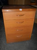 A Four drawer chest of drawers in the style of G Plan. In good condition.