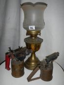 An old brass oil lamp complete with chimney.