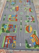 A road layout rug 100 x 200 cm, a red rug 120 x 60 cm and a Chinese rug 160 x 100 cm.