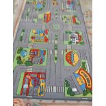 A road layout rug 100 x 200 cm, a red rug 120 x 60 cm and a Chinese rug 160 x 100 cm.