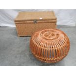 A circular wicker table 63 cm diameter x 40 cm high and a rattan blanket box with hinged lid L 85