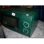 An LG microwave oven in green, in good condition.