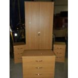 A 4 piece bedroom suite comprising wardrobe and 3 x 3 drawer chests.