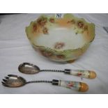 An early 20th century Carlton ware salad bowl with servers.