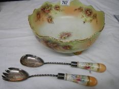 An early 20th century Carlton ware salad bowl with servers.