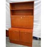 A teak 3 door bedroom unit with lockable mirrored shelf with light, H 175 cm, W 100 cm, D 45 cm.