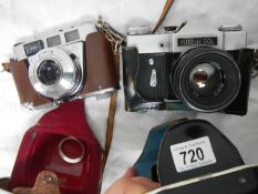 A Prinzflex 500 camera and a Kodak Retinette camera.