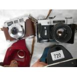 A Prinzflex 500 camera and a Kodak Retinette camera.