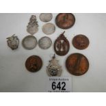 A mixed lot of metal discs including 6 silver (52 grams).