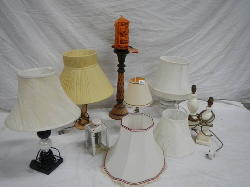 6 table lamps, a carriage candle holder and a new Novalum shimmering candle with stand.