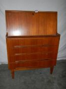 A teak desk in good condition for age, 81 x 40 x 108 cm.