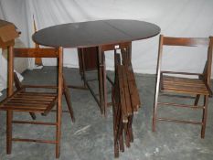 A good fold out oak veneer table with 4 folding chairs inside, 135 x 97 x 74 when open.