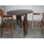 A good fold out oak veneer table with 4 folding chairs inside, 135 x 97 x 74 when open.