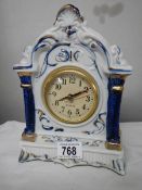 A blue and white quartz mantel clock.