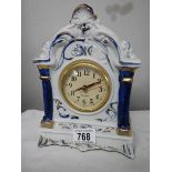 A blue and white quartz mantel clock.