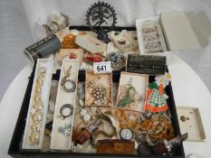 A mixed lot of costume jewellery including old Indian mascot.