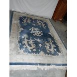 A 5 dragon plush carpet in good condition but needs a clean, approximately 2 x 3 m.