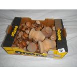 A large box of mainly pine knobs and legs, most with screws.