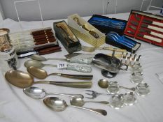 A good lot of silver plate including cutlery, servers, toast rack, sugar scoop etc.