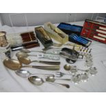 A good lot of silver plate including cutlery, servers, toast rack, sugar scoop etc.