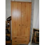A double door wardrobe with 2 bottom drawers, 80cm wide.