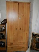 A double door wardrobe with 2 bottom drawers, 80cm wide.