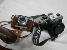 A Voigtlander camera and a Praktica MTLS camera.