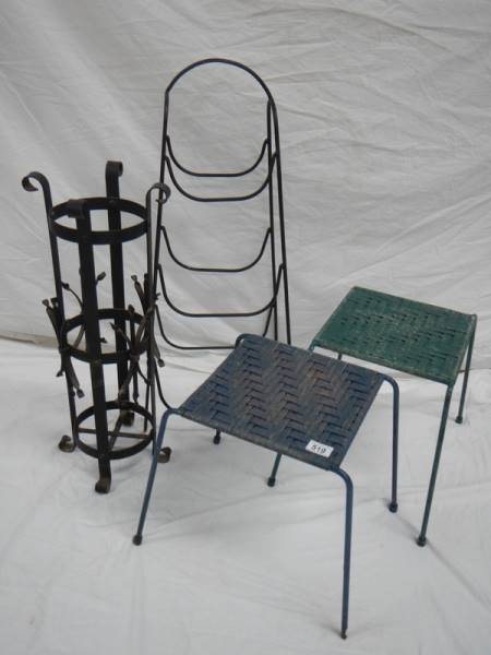 An umbrella stand, 2 woven stop stools and a steel rack.