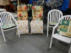 2 folding garden chairs and 3 white garden chairs.