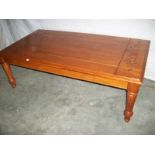 A good solid mahogany side table on tapered legs with carving to top, 122 cm long,