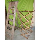 An old wooden step ladder and a clothes airer.